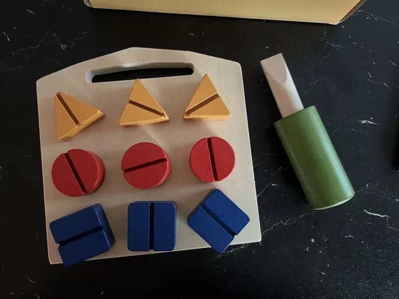 Reviewer photo of the board with nine coloured screws and the wooden screwdriver