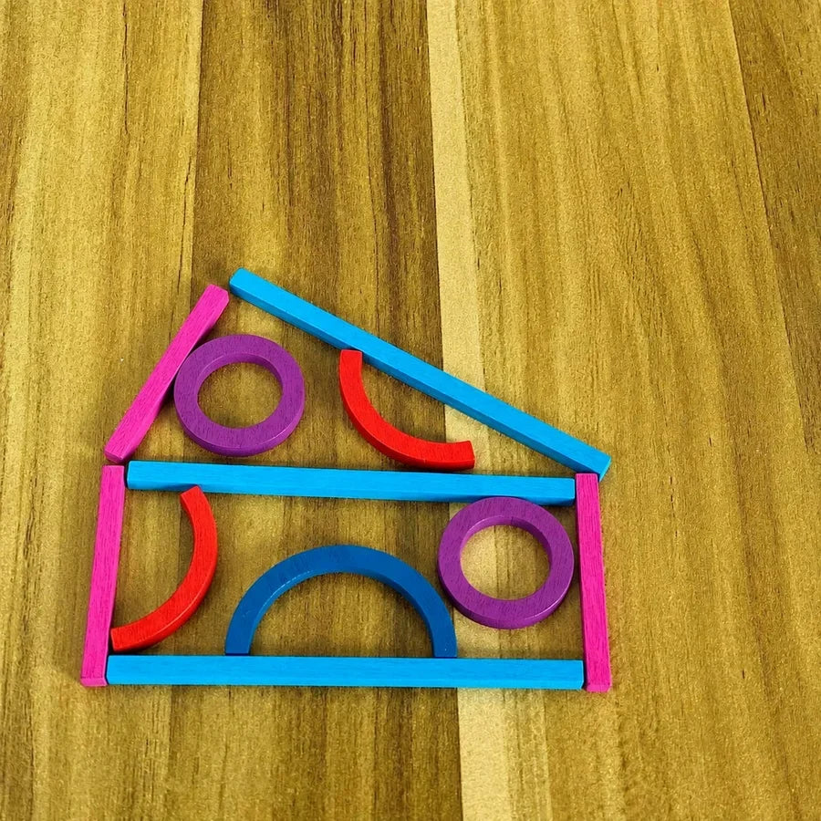 A shape made from sticks and rings on the table, with no card in view.