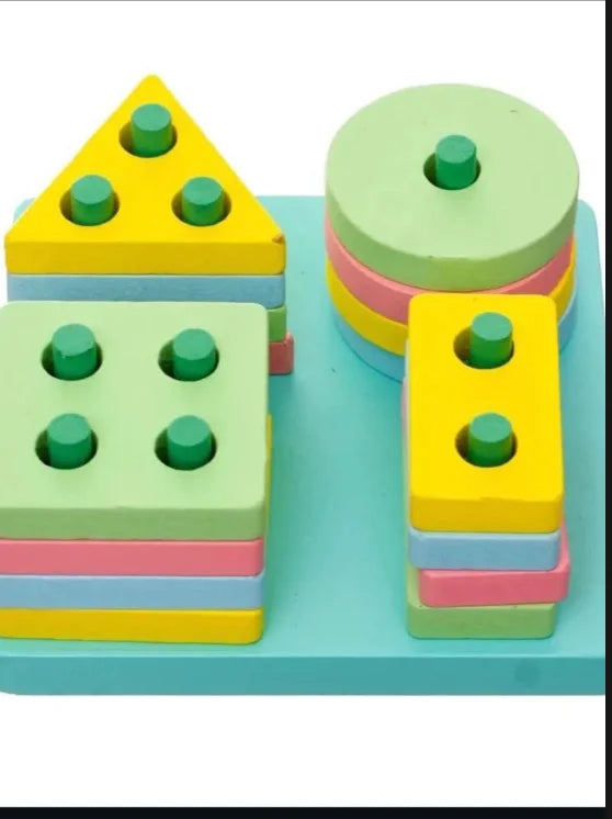 Four shape towers stacked on a square wooden base