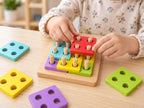 Child placing coloured pieces on the logic square board