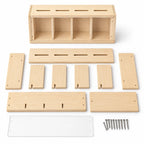 Wooden coin-bank kit pieces, clear panel, and nails before assembly