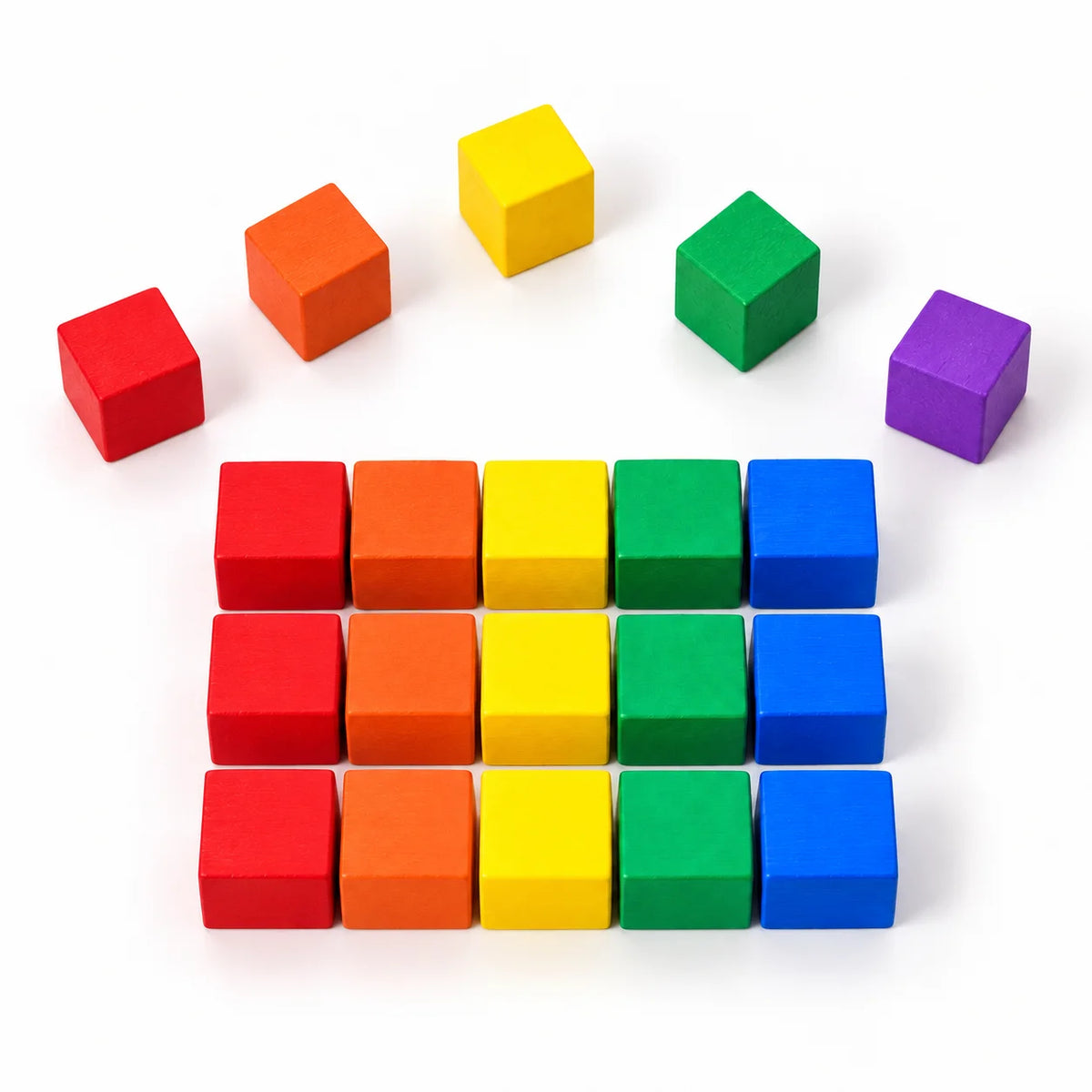 Coloured wooden cubes lined up by colour on a white surface